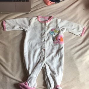 1 newborn sized elephant themed button up one piece of